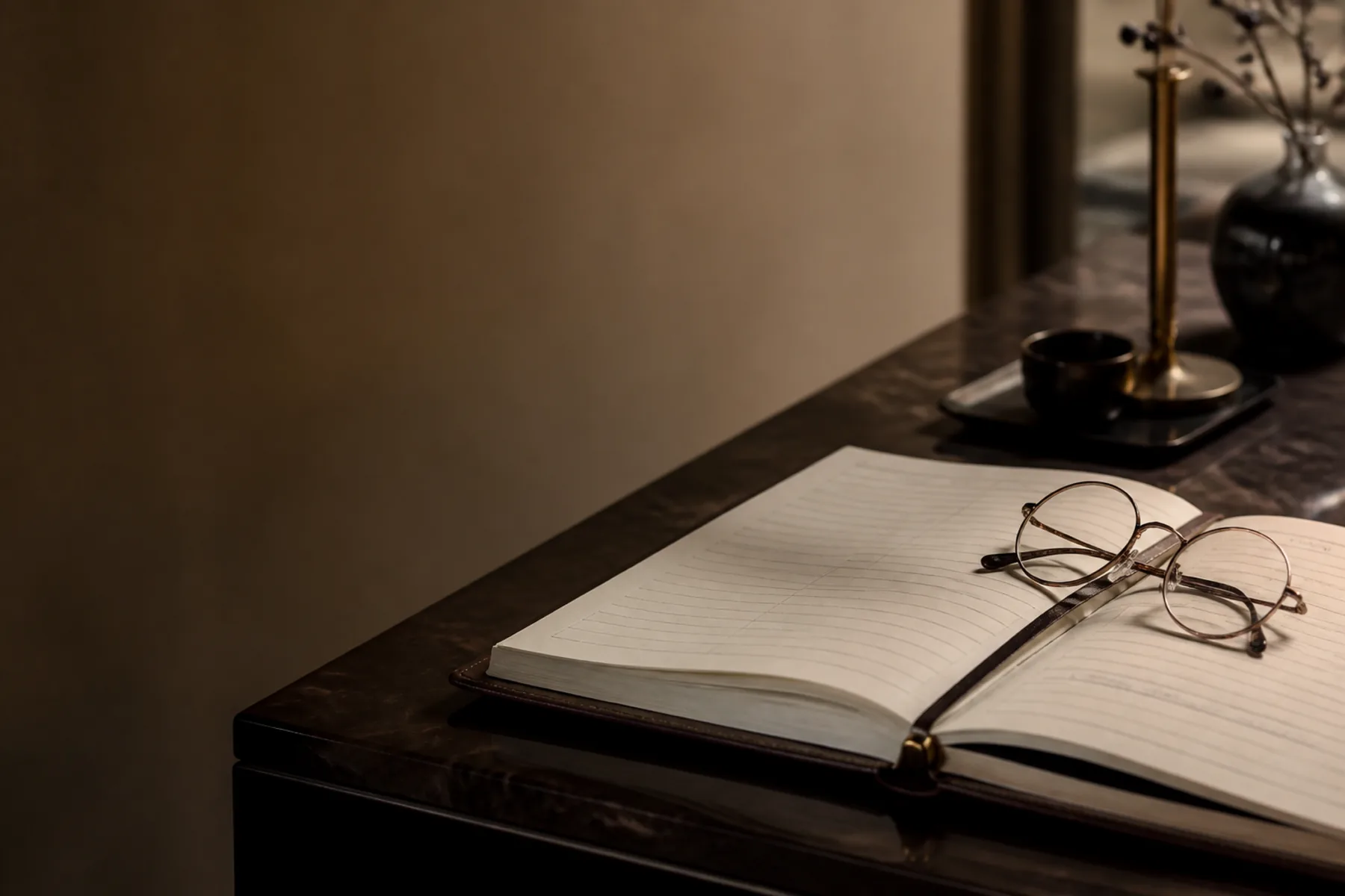 A reservation book open at a host stand, a name written and underlined.
